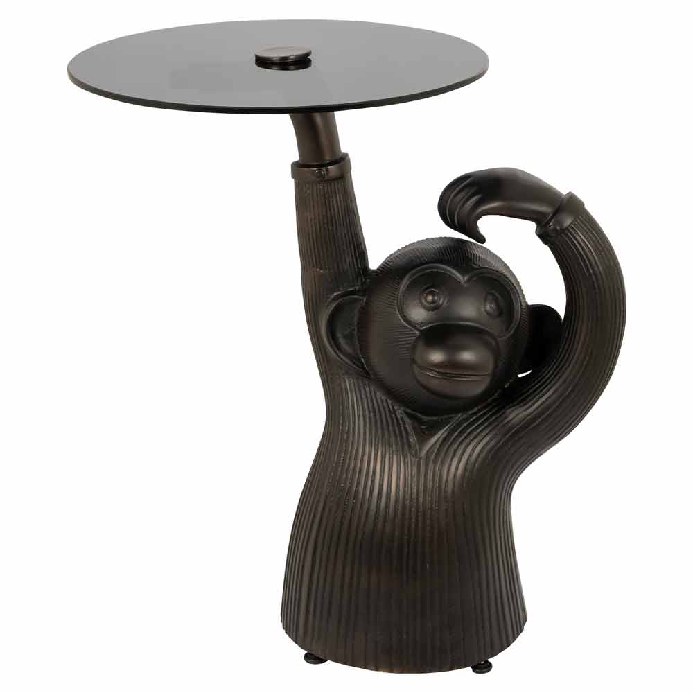 Beistelltisch mit Elefantenrüssel als Ständer, der eine runde Tischplatte trägt. Dunkle Töne, modernes Design.