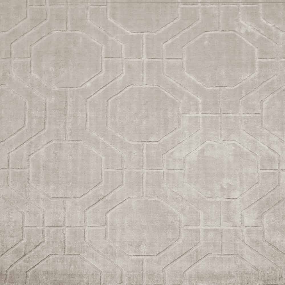Monochromatischer Teppich mit ineinandergreifenden geometrischen Formen, die an Sechsecke erinnern, ideal für moderne Wohn- oder Büroräume.
