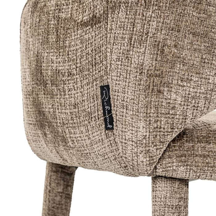Esszimmerstuhl Donnatella (Niagara 104 Stone Chenille), seitlich aufgenommen. Modernes und elegantes Design mit Detailaufnahme