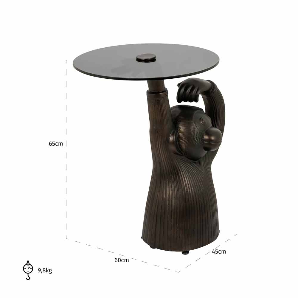 Beistelltisch mit Elefantenfigur als Basis, die eine runde Tischplatte trägt. Dunkle Töne, modernes Design.